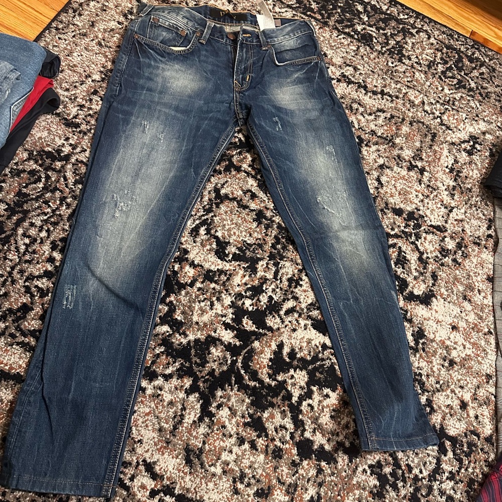 Men jeans worn on 5”8